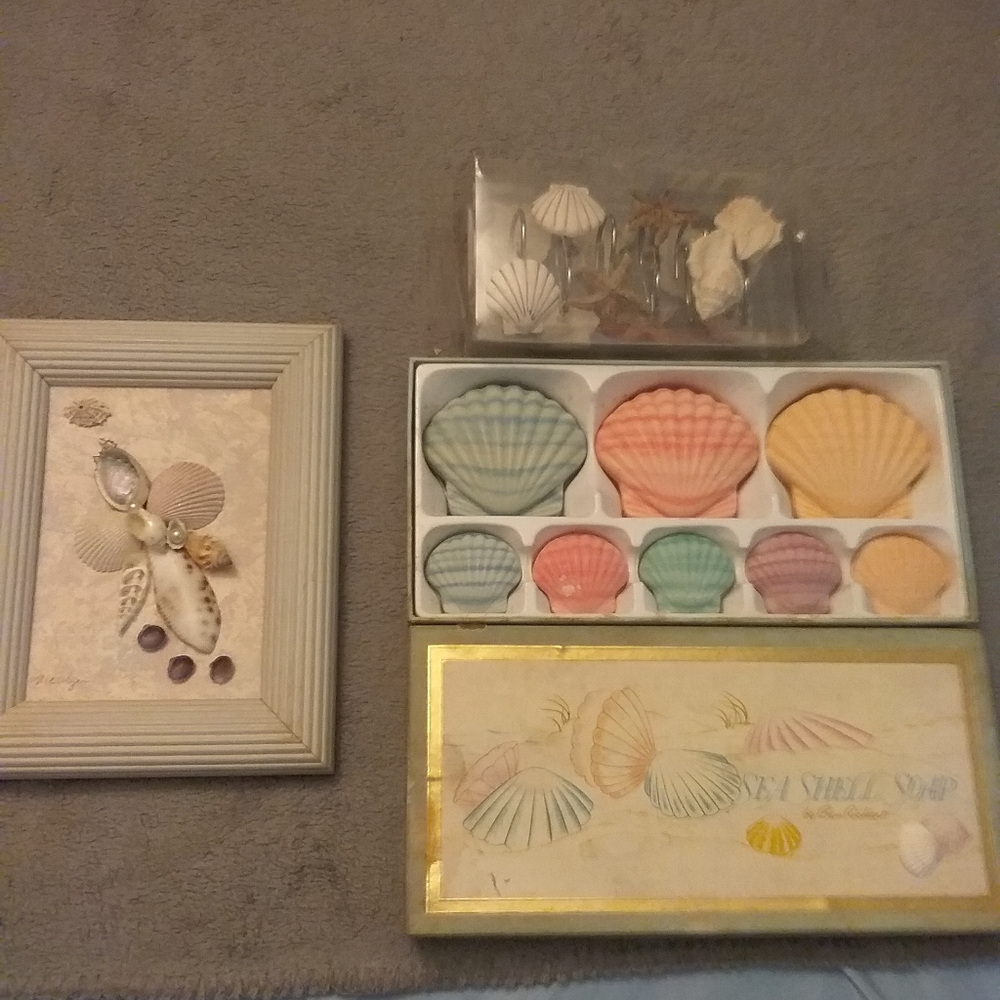 Bundle of Bathroom soaps shower hooks and framed sea shell picture